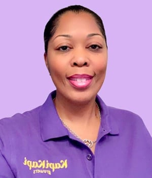 a woman in a purple shirt and a purple shirt