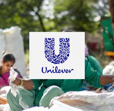 behind the Unilever log women are collecting wastage plastics,