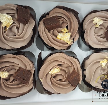 Chocolate cupcakes with hazelnut flavoured buttercream, a piece of homemade hazelnut nougat