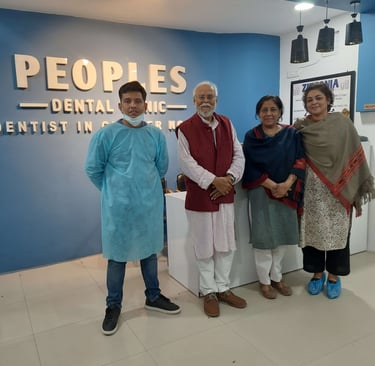 Peoples Dental Clinic - Dr. Ishan Singh with happy dental patients