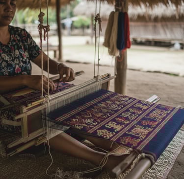 Tenun ikat in the making on a traditional loom