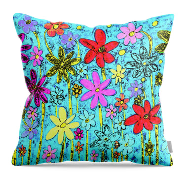 Throw Pillow with a floral design printed on it. 