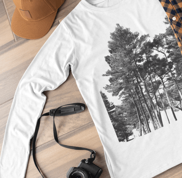 Camera, hat, long sleeved t shirt with nature design on it, glasses  