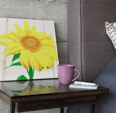 Digital image of a canvas print on a bedside table with an image of an artistic Sunflower on it.