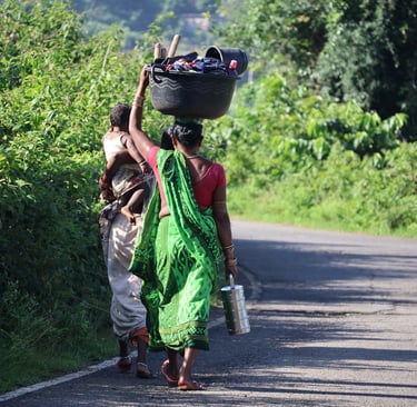 odia women with child going to work on their fields in the morning