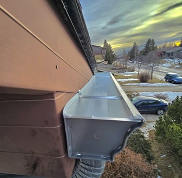 Seamless aluminum gutters and downspouts