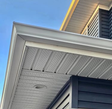 New white gutters and downspouts installation