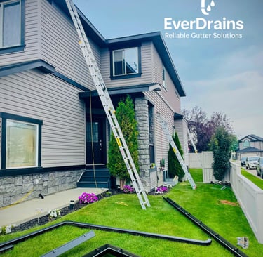 Professional gutter installation by EverDrains team on a residential house in Calgary