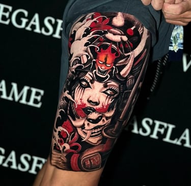 Color Japanese mask tattoo with dramatic red accents