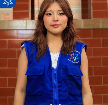 a woman in a blue vest and white shirt