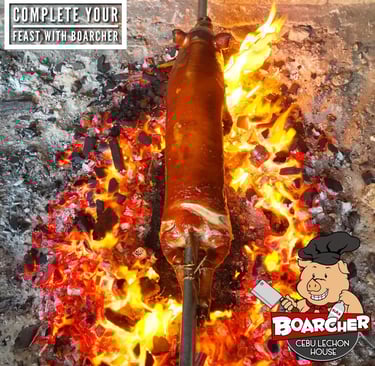 lechon being roasted on a bed of charcoals and flame