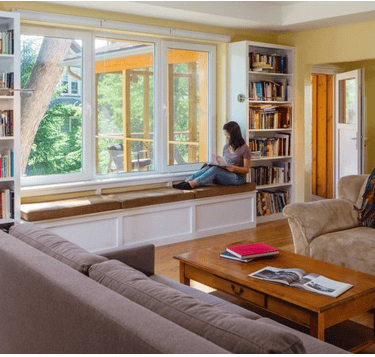 Window seat and shelving in the living room of a Passive House