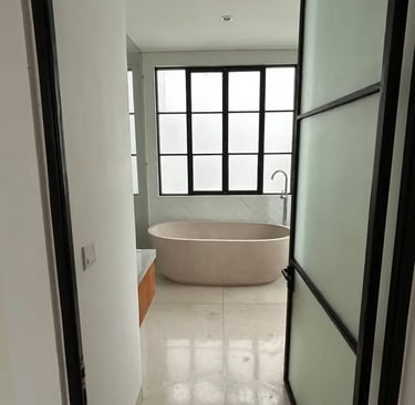terrazzo bathroom in Balinese villa with natural stone and outdoor view
