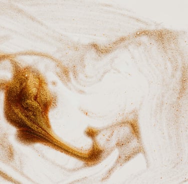 background image - gold glitters swirled on a white surface