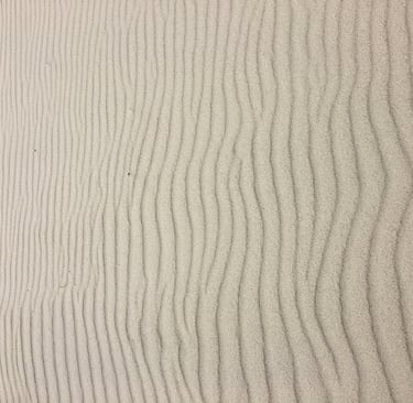 background image - wind waves on a light brown fine sand field