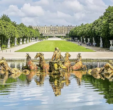 a statue of a man riding a horse drawn carriage