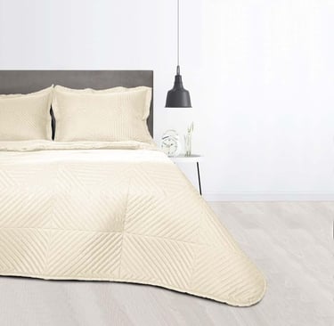 a bed with a white bed and a lamp