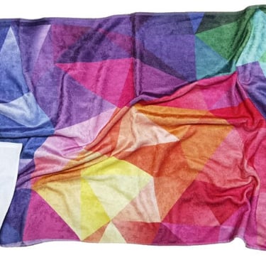 a colorful blanket blanket with a colorful geometric design