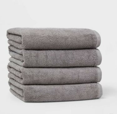 a stack of towels and towels on a white background