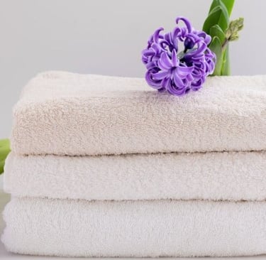 a stack of towels with flowers on a white background