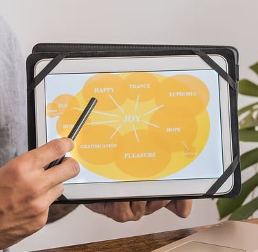 An image of a hand pointing to a diagram on an iPad. 
