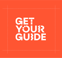 a picture of a person holding a camera and texting get your own guide