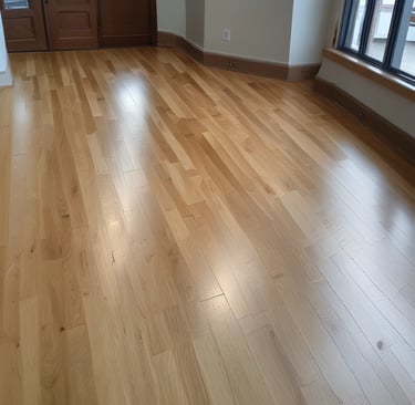 A close-up of a skilled contractor sanding a wooden floor.