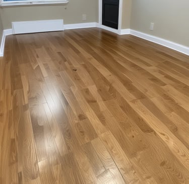 A beautifully refinished hardwood floor reflecting natural light.