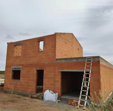 a house being built into a house with a ladder