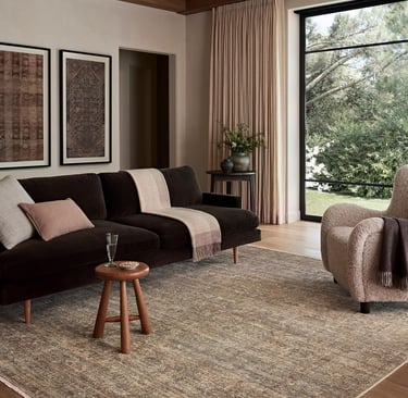 a living room with a couch and a chair
