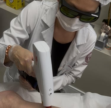 a woman is getting her laser treatment at a laser - assisted device