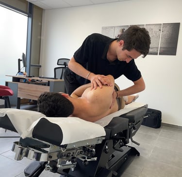 A professional chiropractor performing a manual spinal adjustment on a patient in a clinic.