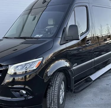 a van parked in front of a garage