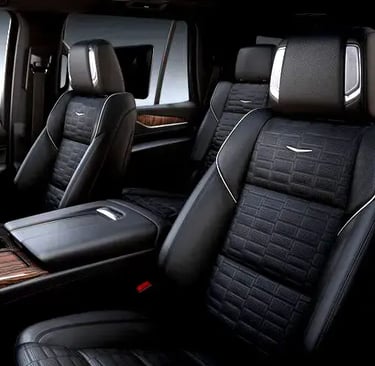 a car with black leather seats and a wooden table