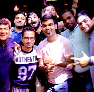 a group of men standing around a man holding a peace sign