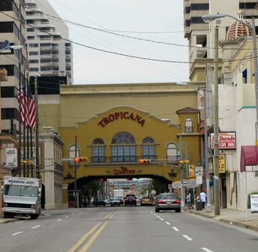 a city street scene with a bus stop sign