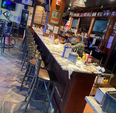 <img src="restaurant-interior.jpg" alt="Restaurant dining room renovation featuring new flooring and lighting installation">
