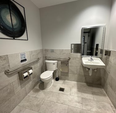 <img src="bathroom-remodel.jpg" alt="Modern commercial bathroom renovation with new tile flooring and fixtures by Retail Work