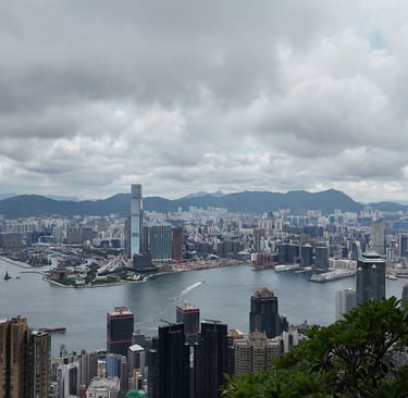 a view of a city skyline with a view of a city Hong kong