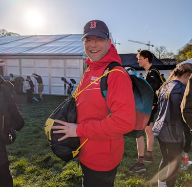 a man in a red jacket and a backpacker