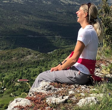 Helen laughing during a hike in Castellaras on the French Riviera