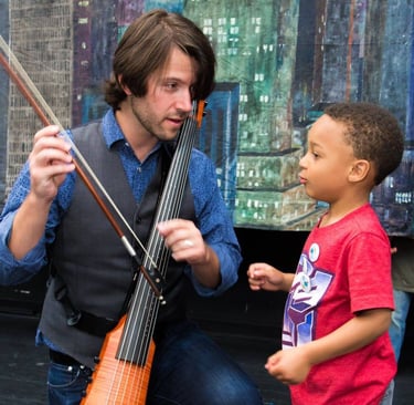 cellist Wytold works with a student