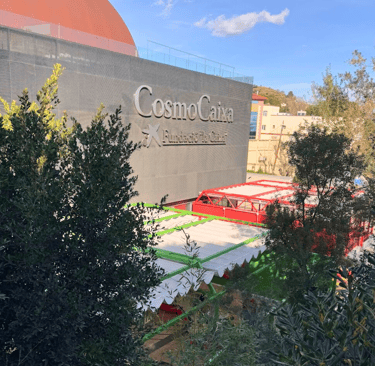 cosmocaixa museum buildin with text "cosmocaixa fundacio la caixa"