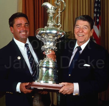 Ronald Reagan and Dennis Conner with the America's Cup at the While House in 1987 by James Drake