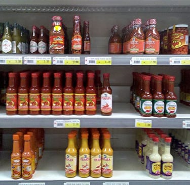 a variety of sauces and sauces on a shelf