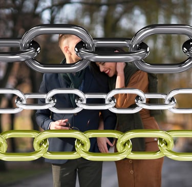 a man and woman standing in front of a chain link link link link link link