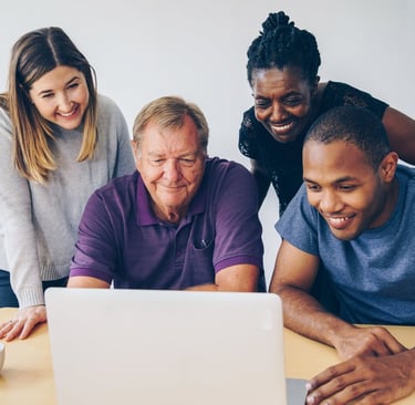 Four Family Members Staring at a Computer