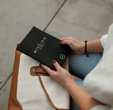 An Empty Nester holding a MISSION Journal