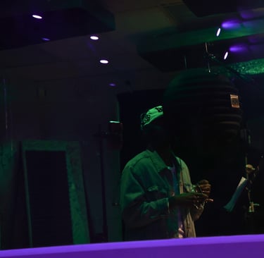 Artist recording in a booth at Troit Ent. Studios