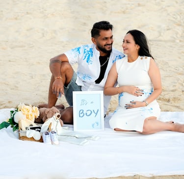 Elegant maternity photoshoot at a serene Dubai beach, capturing the beauty of motherhood.